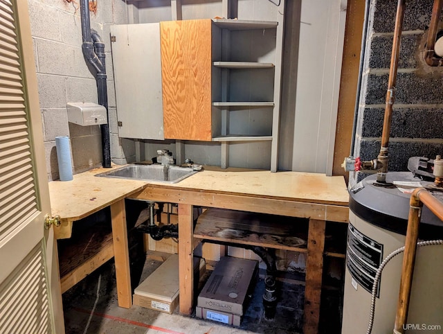 1002 Allouez Rd, Marquette, MI 49855 - below grade area featuring concrete block wall, a sink, and water heater
