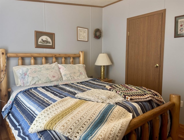 bedroom featuring wood finished floors