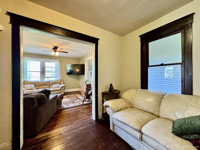 18020 Lake Rd, Pelkie, MI 49958 - living room with dark wood-style flooring, ceiling fan, and baseboards