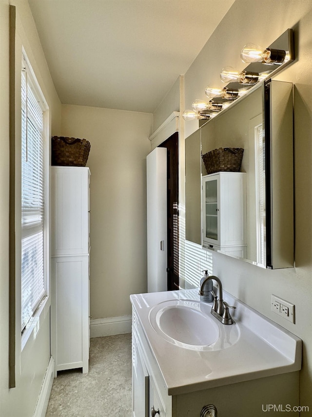 18020 Lake Rd, Pelkie, MI 49958 - bathroom with baseboards and vanity