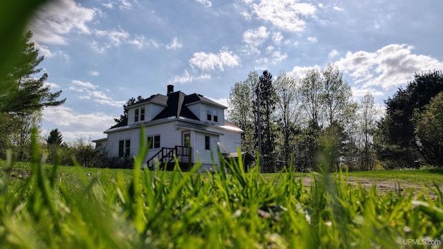 18020 Lake Rd, Pelkie, MI 49958 - view of home's exterior with a chimney