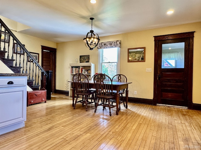 18020 Lake Rd, Pelkie, MI 49958 - dining room with a chandelier, stairway, baseboards, light wood-style floors, and recessed lighting