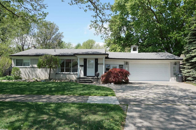 view of front facade featuring an attached garage, concrete driveway, a front lawn, brick siding, and a chimney
