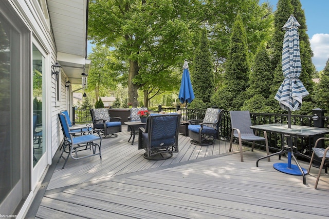 11770 Lennry Rd, Shelby Twp, MI 48315 - deck featuring outdoor dining space and view of wooded area