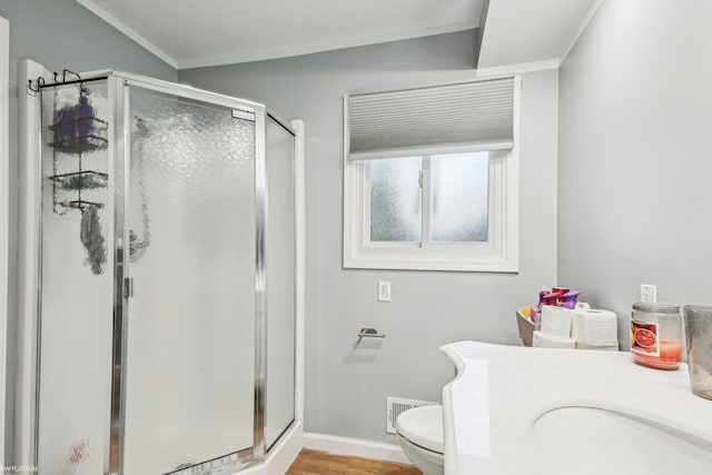 11770 Lennry Rd, Shelby Twp, MI 48315 - bathroom featuring a stall shower, toilet, wood finished floors, and baseboards