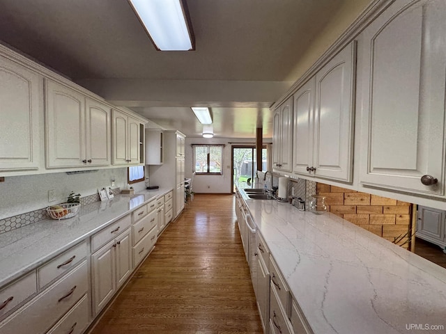 102 Forest Dr, Norway, MI 49870 - kitchen with a sink, dark wood finished floors, decorative backsplash, and light stone counters