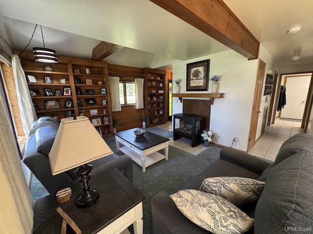 102 Forest Dr, Norway, MI 49870 - tiled living area featuring beamed ceiling and a wood stove