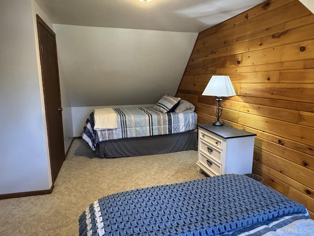 102 Forest Dr, Norway, MI 49870 - carpeted bedroom featuring wooden walls, vaulted ceiling, and baseboards