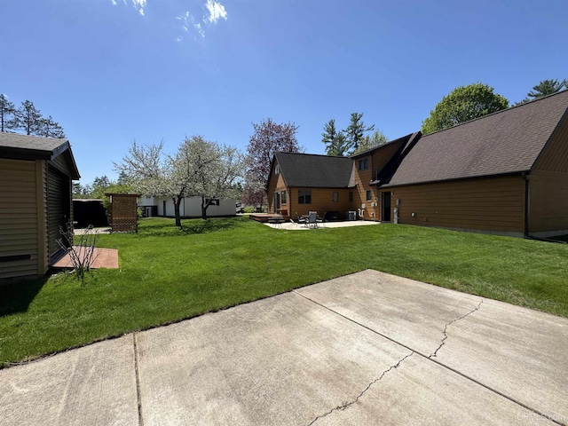 102 Forest Dr, Norway, MI 49870 - view of grassy yard featuring a patio