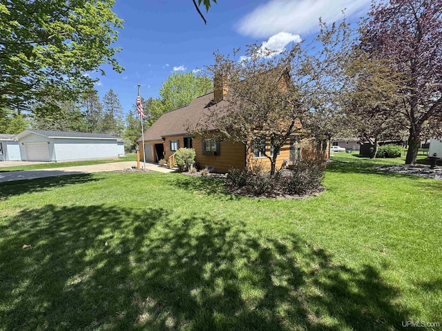 102 Forest Dr, Norway, MI 49870 - view of property exterior featuring a lawn, an outbuilding, a chimney, and a garage