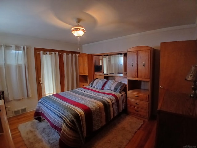 bedroom featuring wood finished floors