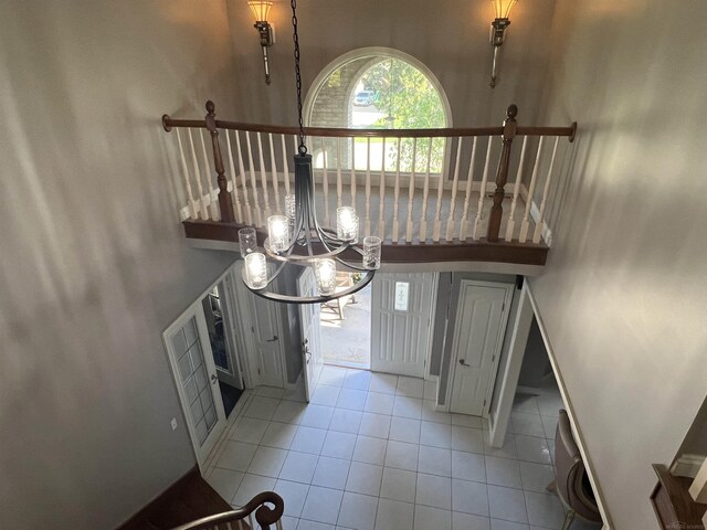 53641 Buckingham Ln, Shelby Twp, MI 48316 - stairs featuring tile patterned flooring and a chandelier