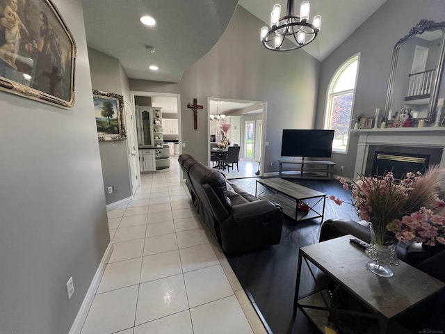 53641 Buckingham Ln, Shelby Twp, MI 48316 - living area featuring a chandelier, light tile patterned floors, baseboards, a fireplace, and recessed lighting