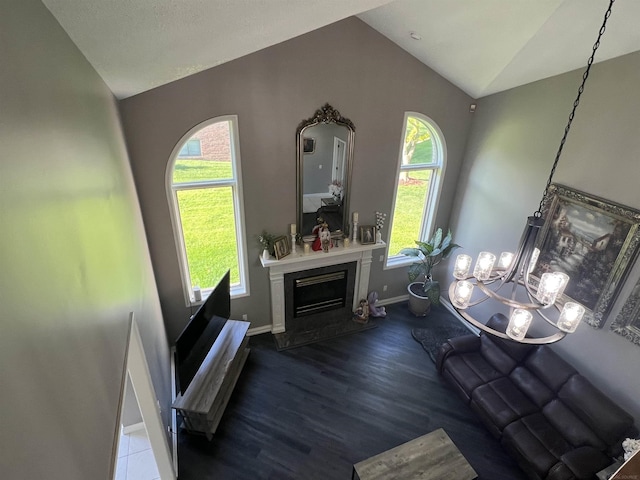 53641 Buckingham Ln, Shelby Twp, MI 48316 - living room with vaulted ceiling, baseboards, healthy amount of natural light, wood finished floors, and a glass covered fireplace