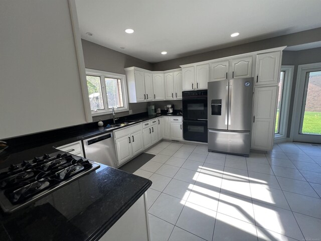 53641 Buckingham Ln, Shelby Twp, MI 48316 - kitchen with black appliances, a sink, dark countertops, healthy amount of natural light, and recessed lighting