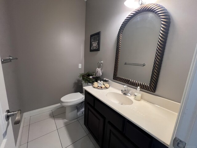 53641 Buckingham Ln, Shelby Twp, MI 48316 - half bath with vanity, toilet, tile patterned floors, and baseboards