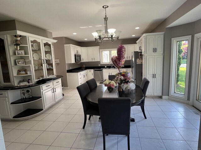 53641 Buckingham Ln, Shelby Twp, MI 48316 - dining area with a chandelier, recessed lighting, and light tile patterned floors