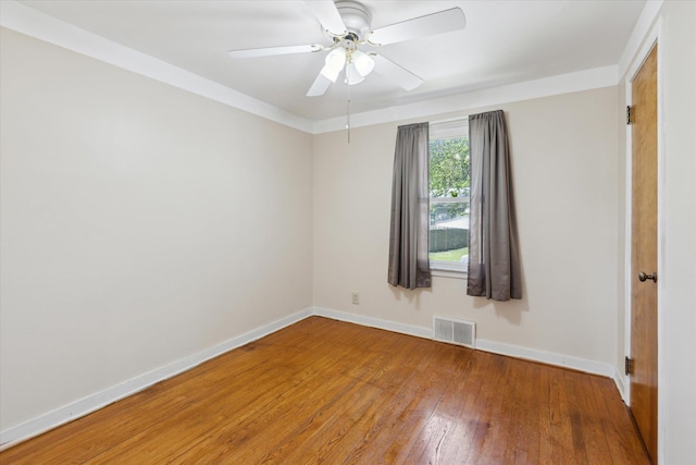 402 E Fisher St, Bay City, MI 48706 - unfurnished room featuring baseboards, wood-type flooring, and ceiling fan