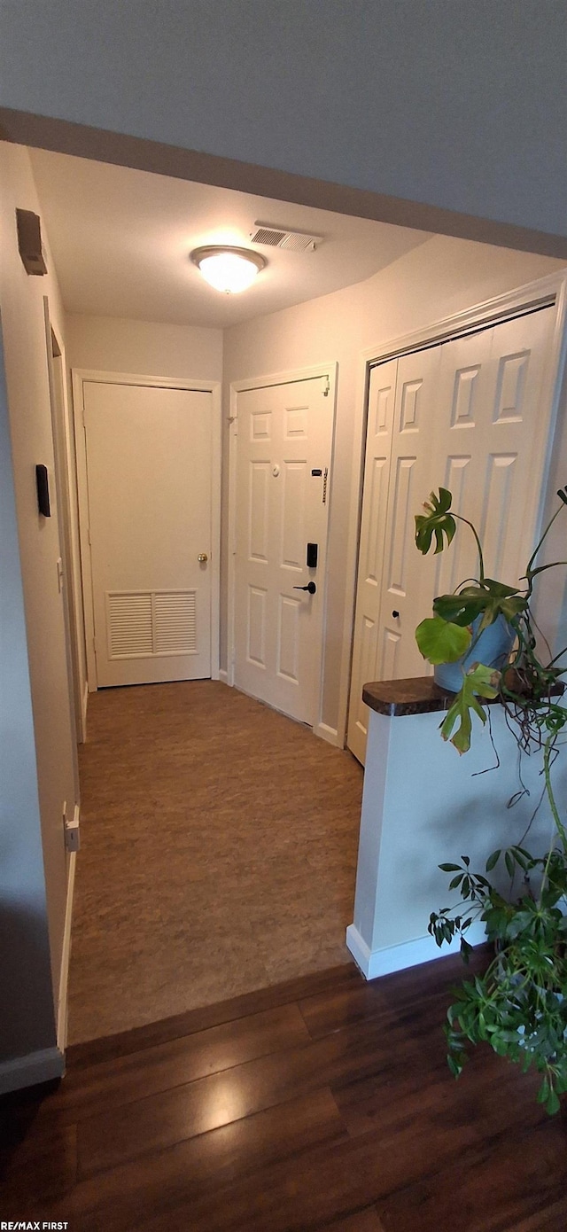 38770 Lanse Creuse St, Harrison Twp, MI 48045 - hall featuring dark wood-style floors and baseboards