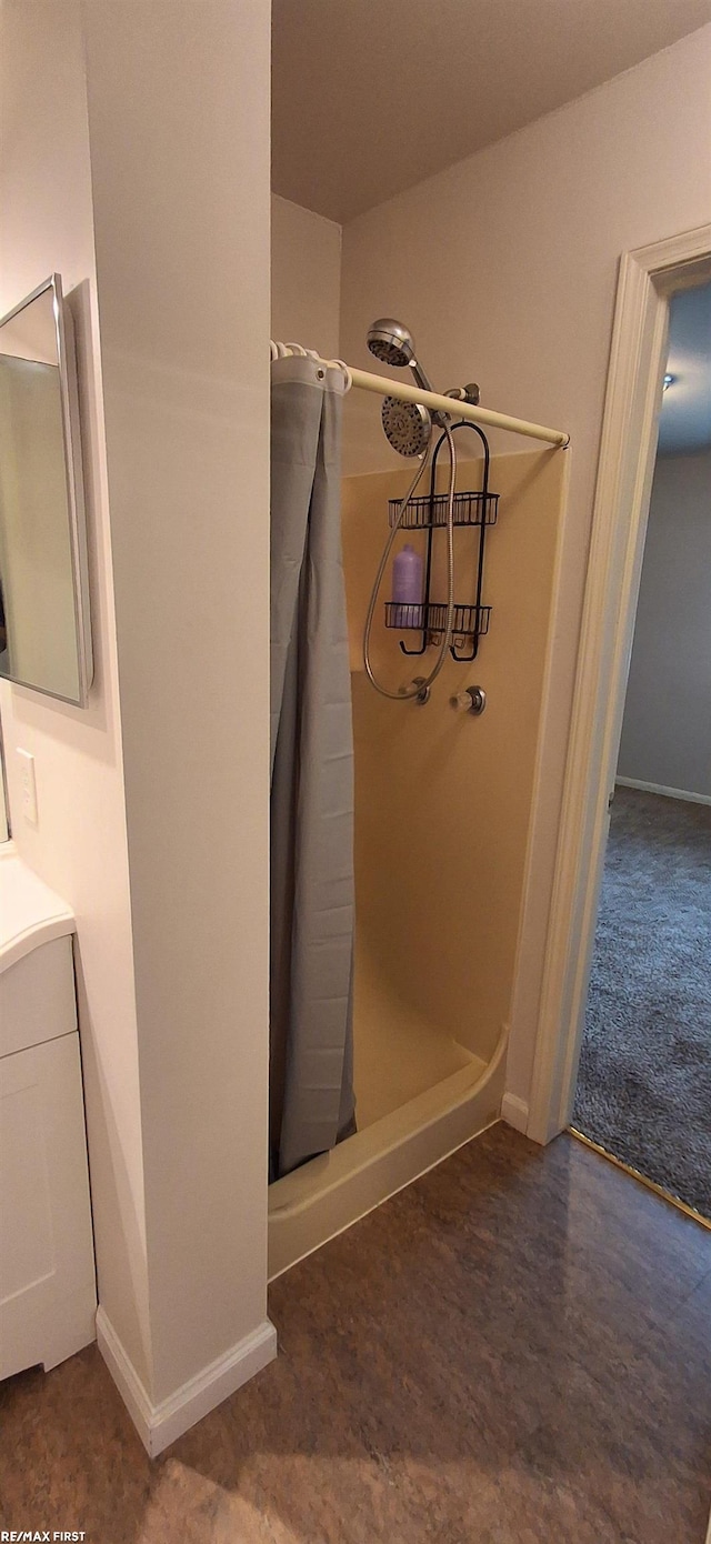 38770 Lanse Creuse St, Harrison Twp, MI 48045 - bathroom featuring a shower stall, vanity, and baseboards