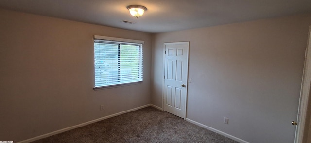 38770 Lanse Creuse St, Harrison Twp, MI 48045 - empty room featuring dark colored carpet and baseboards