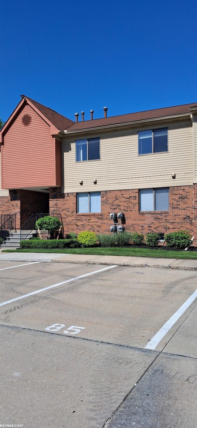 38770 Lanse Creuse St, Harrison Twp, MI 48045 - view of building exterior with uncovered parking