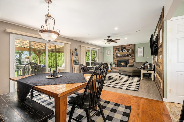 38186 Jefferson Ave, Harrison Twp, MI 48045 - dining space featuring a ceiling fan, a fireplace, light wood-type flooring, and recessed lighting
