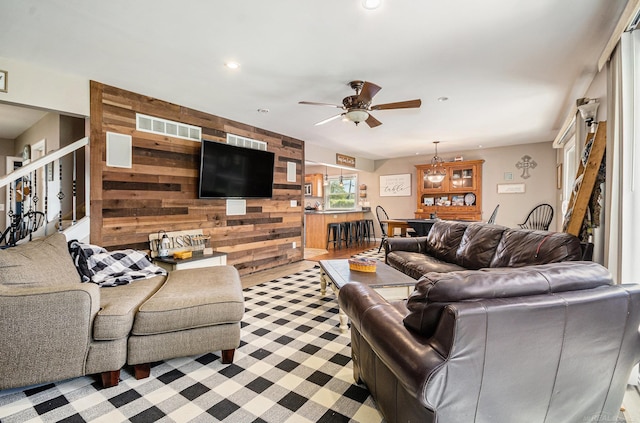 38186 Jefferson Ave, Harrison Twp, MI 48045 - living area with wooden walls, ceiling fan, recessed lighting, and stairway