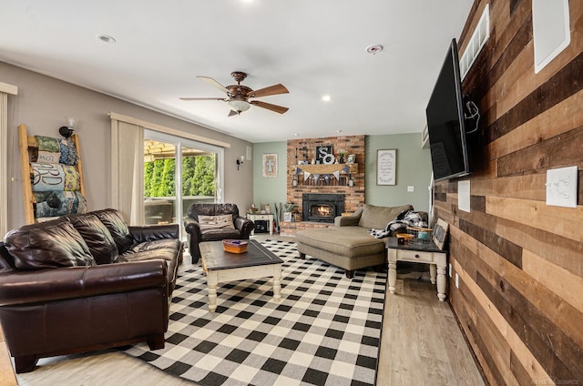 38186 Jefferson Ave, Harrison Twp, MI 48045 - living area with light wood-type flooring, ceiling fan, a brick fireplace, wood walls, and recessed lighting