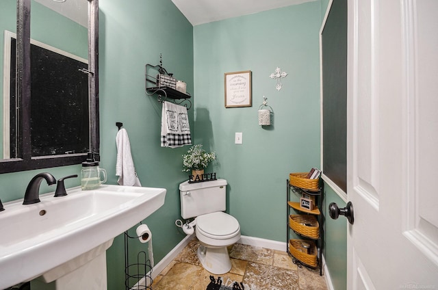 38186 Jefferson Ave, Harrison Twp, MI 48045 - bathroom featuring stone tile flooring, a sink, baseboards, and toilet