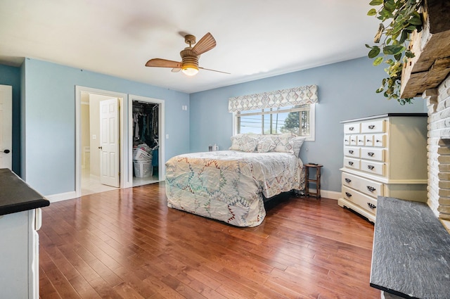 38186 Jefferson Ave, Harrison Twp, MI 48045 - bedroom featuring wood finished floors, baseboards, a ceiling fan, and a spacious closet