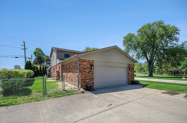 38186 Jefferson Ave, Harrison Twp, MI 48045 - view of side of home with brick siding, a gate, an attached garage, and driveway