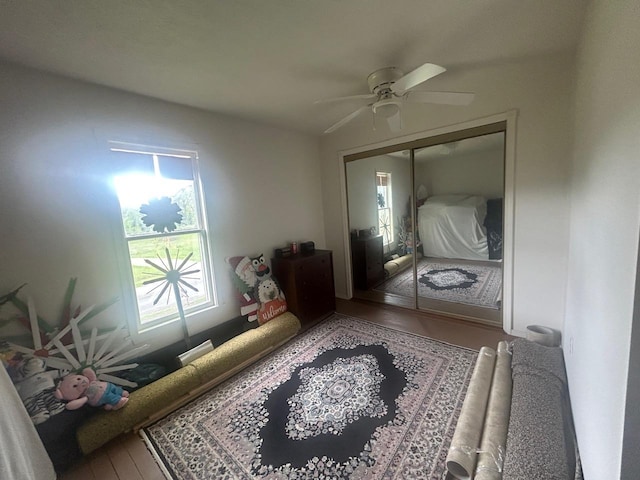 4550 Calhoun Rd, Beaverton, MI 48612 - bedroom with wood finished floors, ceiling fan, and a closet