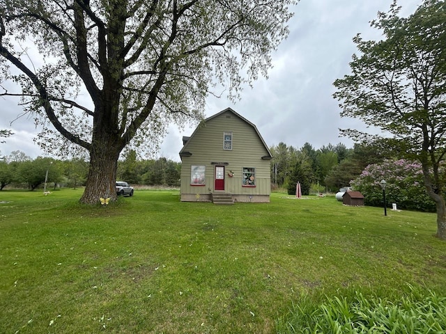 4550 Calhoun Rd, Beaverton, MI 48612 - back of house featuring a yard