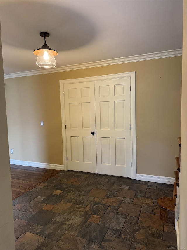 4283 Snoal Ln, Shelby Twp, MI 48316 - spare room with baseboards, ornamental molding, and stone tile flooring