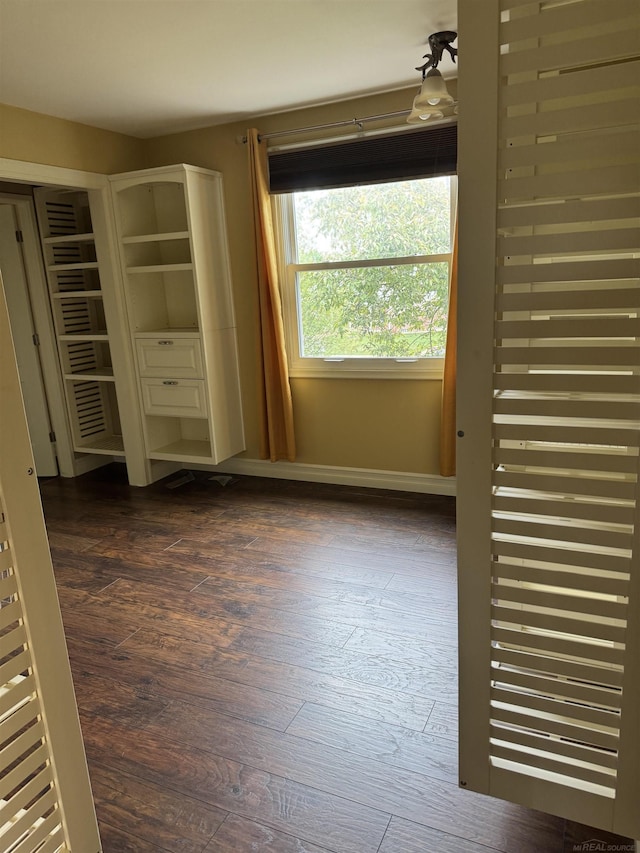 4283 Snoal Ln, Shelby Twp, MI 48316 - unfurnished bedroom with dark wood-style floors