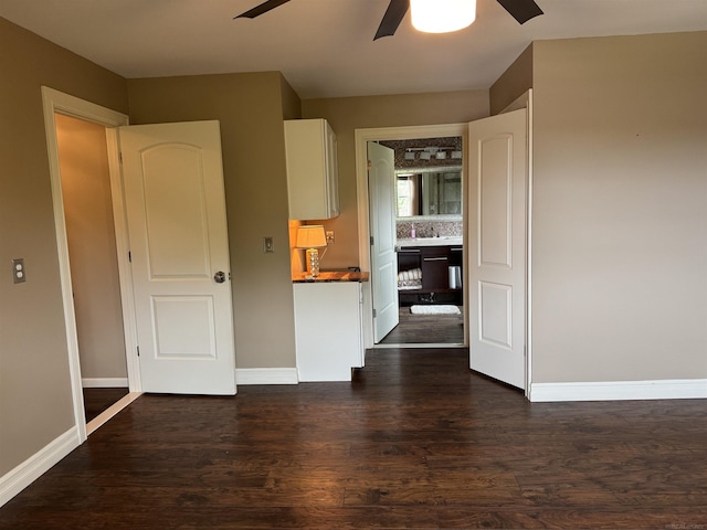 4283 Snoal Ln, Shelby Twp, MI 48316 - unfurnished room featuring a ceiling fan, dark wood-style floors, baseboards, and a sink