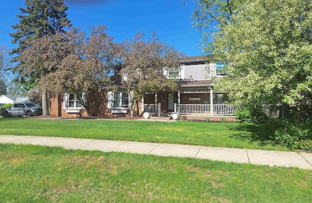 4283 Snoal Ln, Shelby Twp, MI 48316 - view of front of home with a front lawn and covered porch