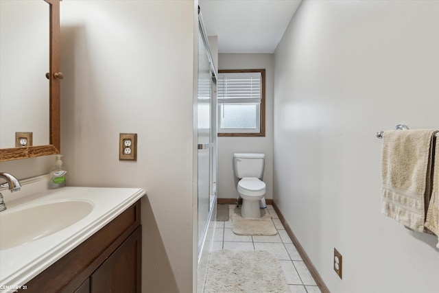 1497 Parke St, Rochester Hills, MI 48307 - bathroom featuring toilet, tile patterned floors, vanity, and baseboards