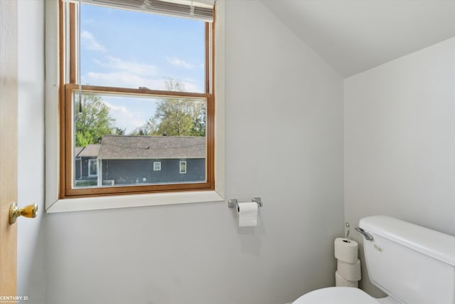 1497 Parke St, Rochester Hills, MI 48307 - half bathroom featuring toilet and lofted ceiling
