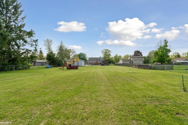 1497 Parke St, Rochester Hills, MI 48307 - view of yard featuring an outdoor structure and a storage unit
