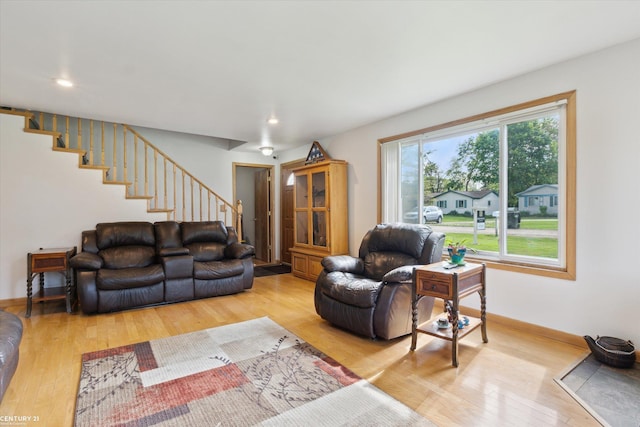 1497 Parke St, Rochester Hills, MI 48307 - living area featuring stairs, light wood-style flooring, recessed lighting, and baseboards