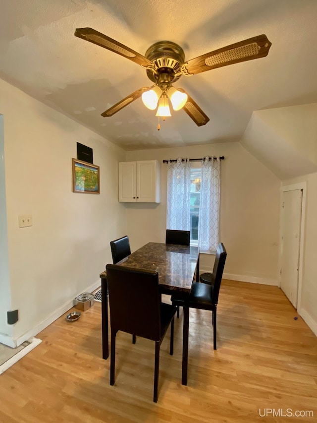 213 N Fifth St, Marquette, MI 49855 - dining space with light wood-type flooring, a ceiling fan, and baseboards