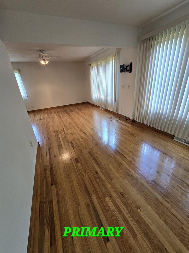 41 W River Dr, Gladwin, MI 48624 - empty room with wood finished floors and a ceiling fan