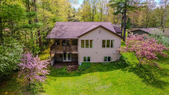 41 W River Dr, Gladwin, MI 48624 - back of property with a yard and a wooden deck