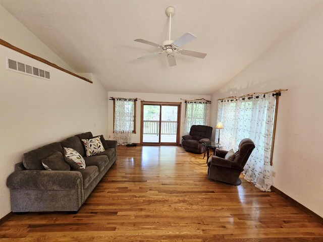 41 W River Dr, Gladwin, MI 48624 - living room featuring wood finished floors, ceiling fan, high vaulted ceiling, and baseboards
