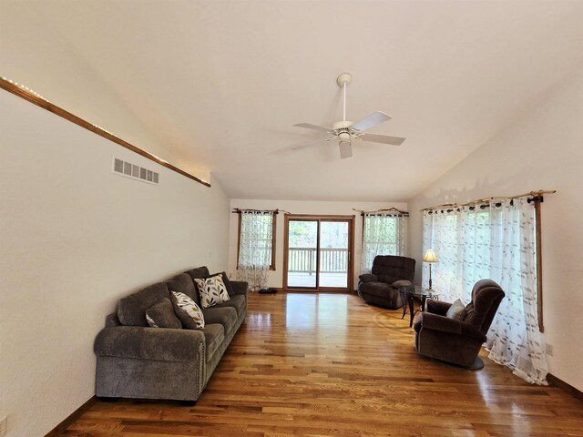 41 W River Dr, Gladwin, MI 48624 - living area with wood finished floors, a ceiling fan, high vaulted ceiling, and baseboards