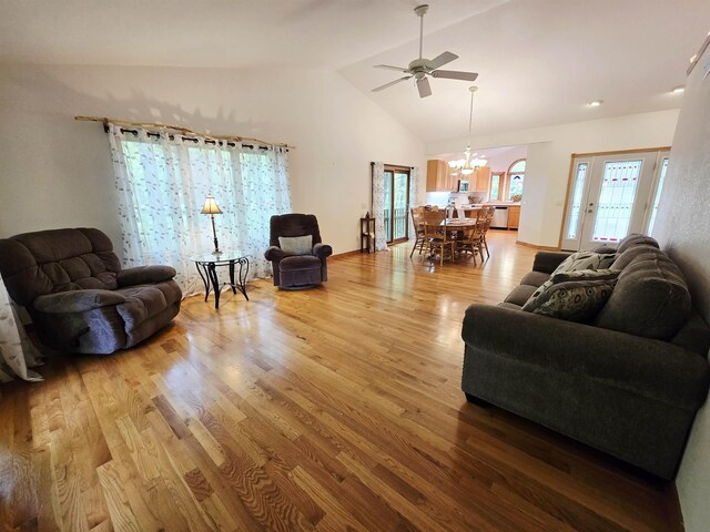 41 W River Dr, Gladwin, MI 48624 - living area featuring a ceiling fan, a chandelier, light wood-style flooring, and lofted ceiling
