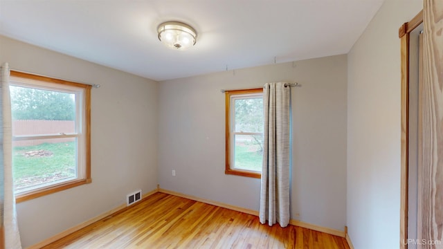 730 Elliott Ave, Ishpeming, MI 49855 - empty room featuring light wood-style flooring and baseboards