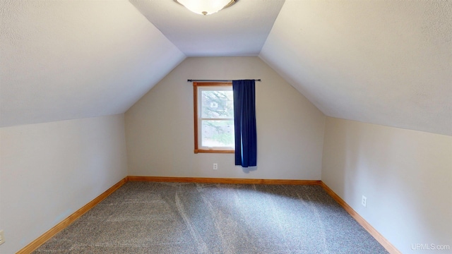 730 Elliott Ave, Ishpeming, MI 49855 - bonus room featuring carpet floors, lofted ceiling, and baseboards